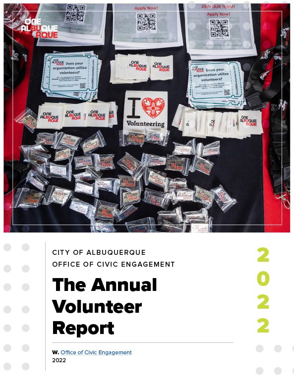 The front cover of the Office of Civic Engagement Annual Volunteer Report 2022 featuring a photo of a table full of One Albuquerque logo stickers and pins.