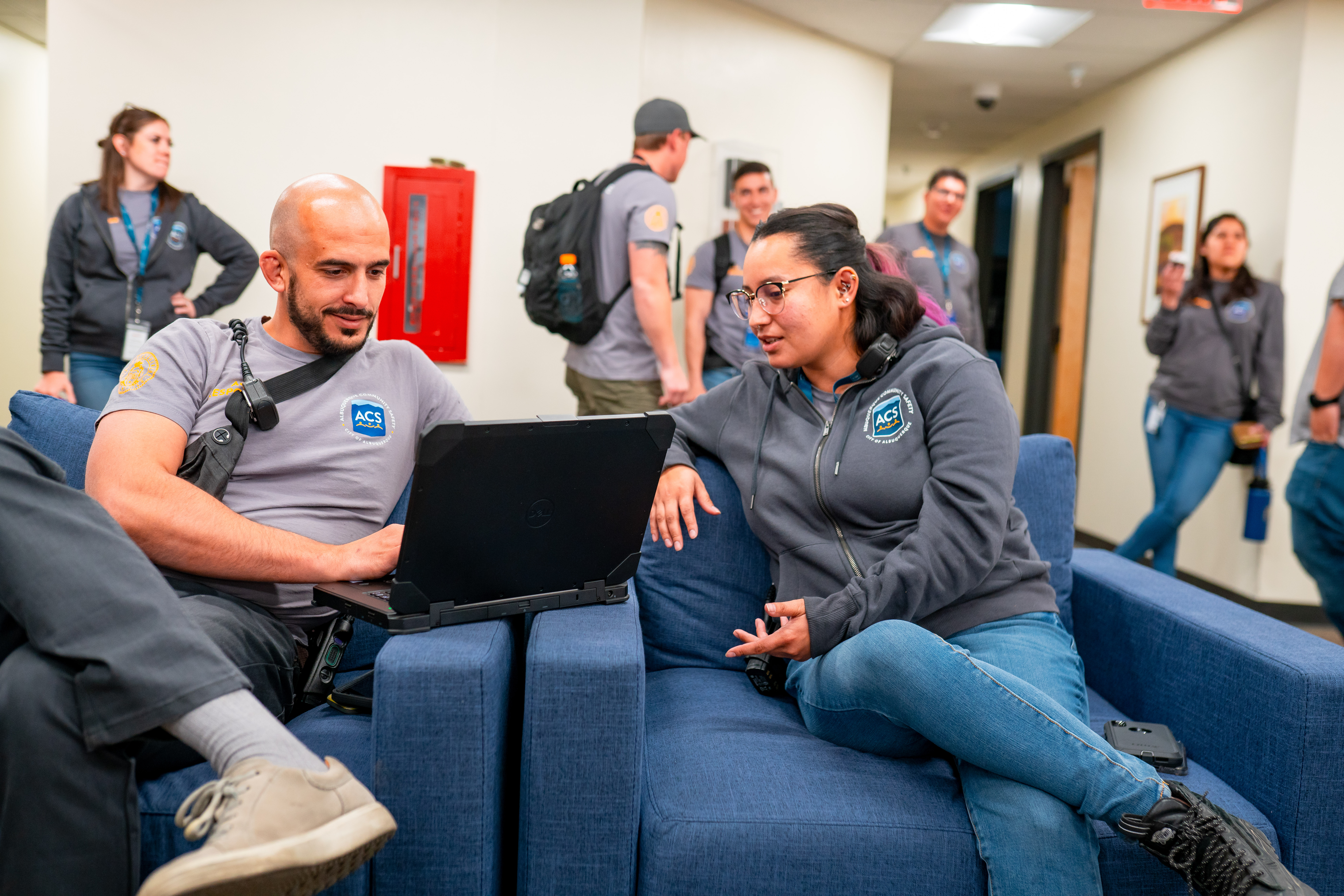 Two Albuquerque Community Safety staff members at a recruitment event.