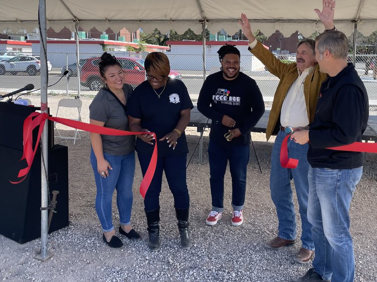 Mayor and other local leaders cutting ribbon