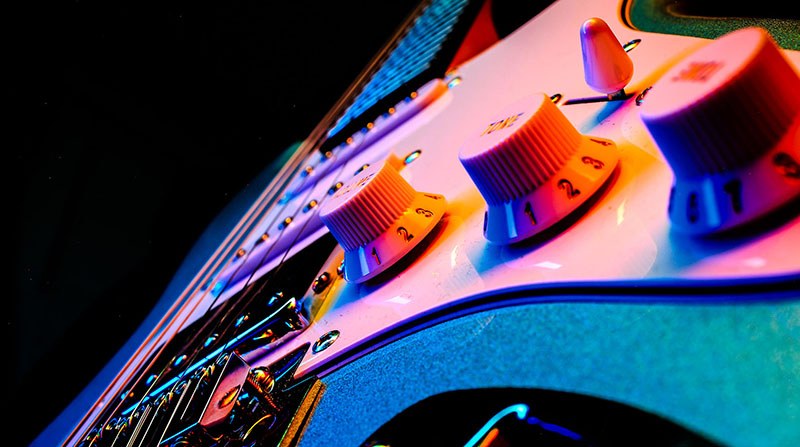 Color photograph of a guitar detail
