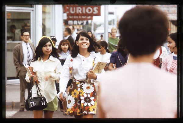 A vintage photo of women walking down a street in Albuquerque.