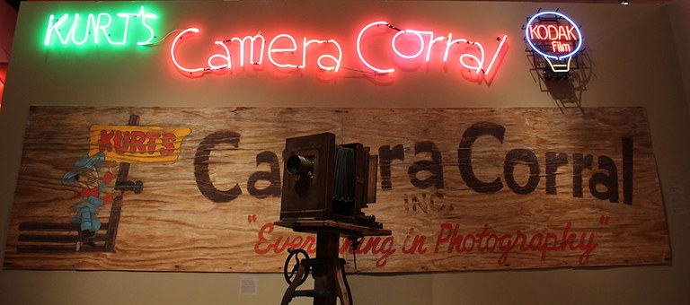 Neon signs on a wall.