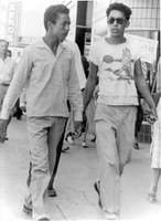 Richard Baca and Fernie Espinosa, downtown Albuquerque, 1951.  Baca-Jaramillo Collection, 1998.9.5.  Both boys sport fashionable pompadours.