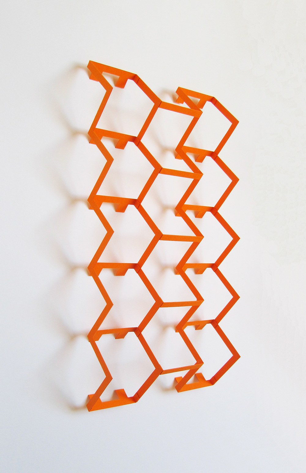 A modern, 3D artwork featuring rows of squares in orange. Part of the Unfolding Tradition exhibition at Albuquerque Museum 2019.