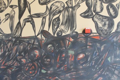 Gronk Mural Detail 1 A detail image of Gronk's 2011 Visiting Artist installation, showing expressionistic black, green, and red marks on a tan wall.