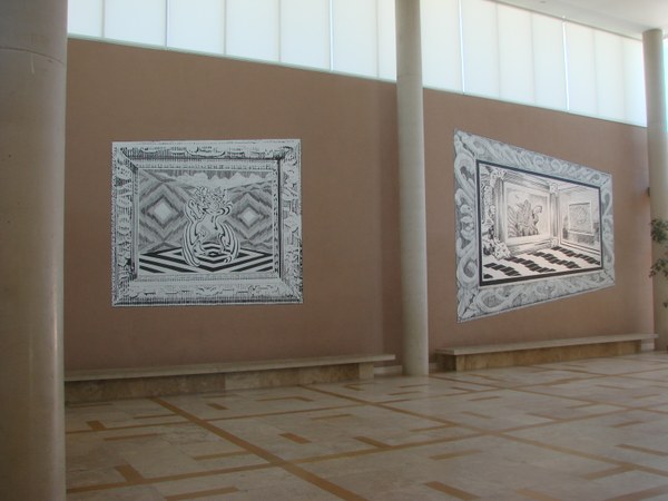 A two-panel, black-and-white mural installed on the wall of the Albuquerque Museum lobby. Each panel depicts the interior of a surreal room, surrounded by a faux frame.