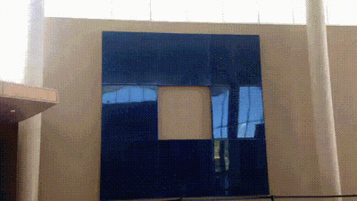 Paul Sarkisian, Untitled (blue8) & Untitled (magenta16) An animated view of Paul Sarkisian's Visiting Artist exhibition, panning across two large, wall-mounted works composed of colorful squares installed in the lobby of the Albuquerque Museum.
