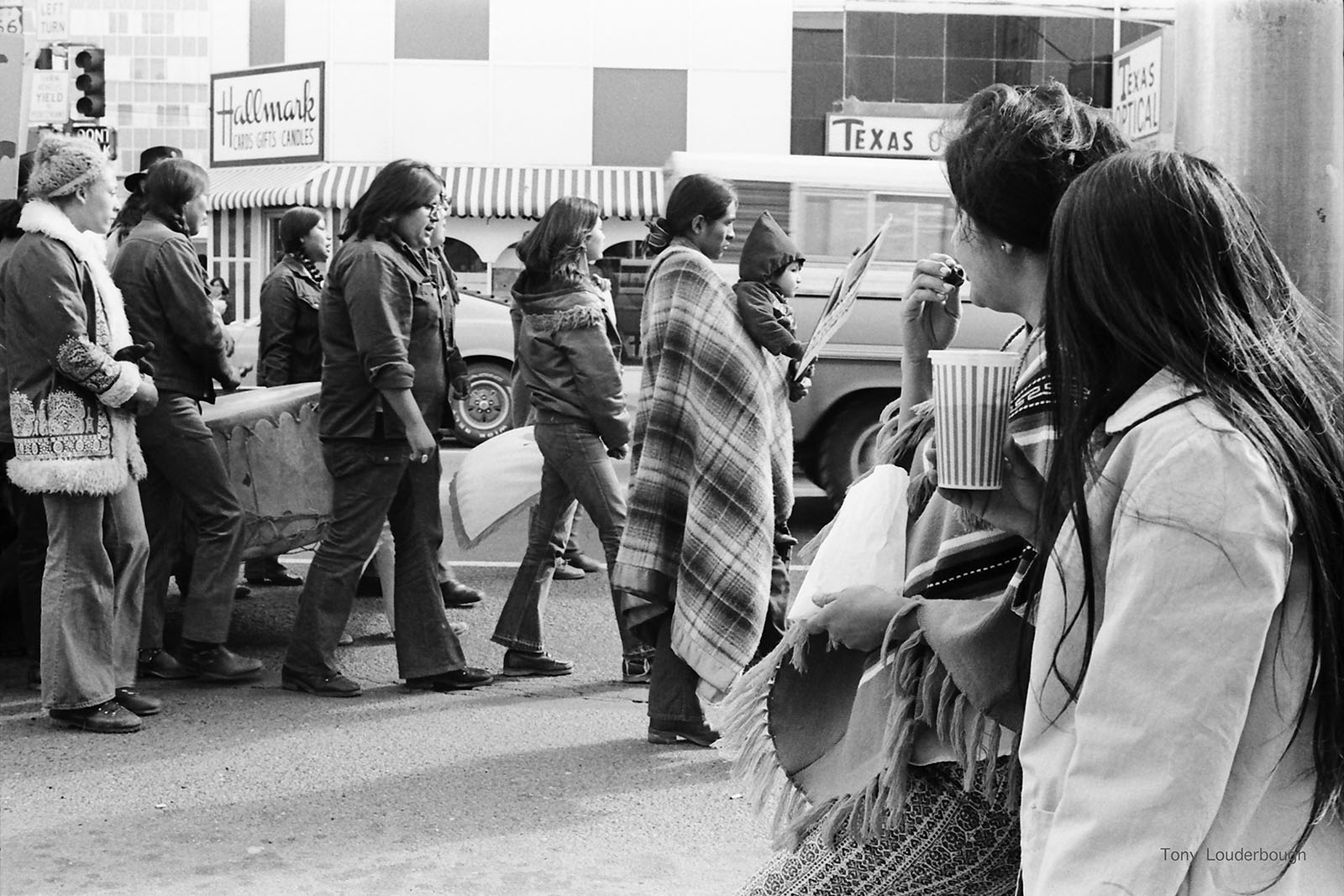 Anthony Louderbough, Marchers Pass in front of a Hallmark Store in Downtown Albuquerque