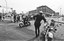 Anthony Louderbough, Police on Motorcycles Watch Demonstrators March along Central Avenue