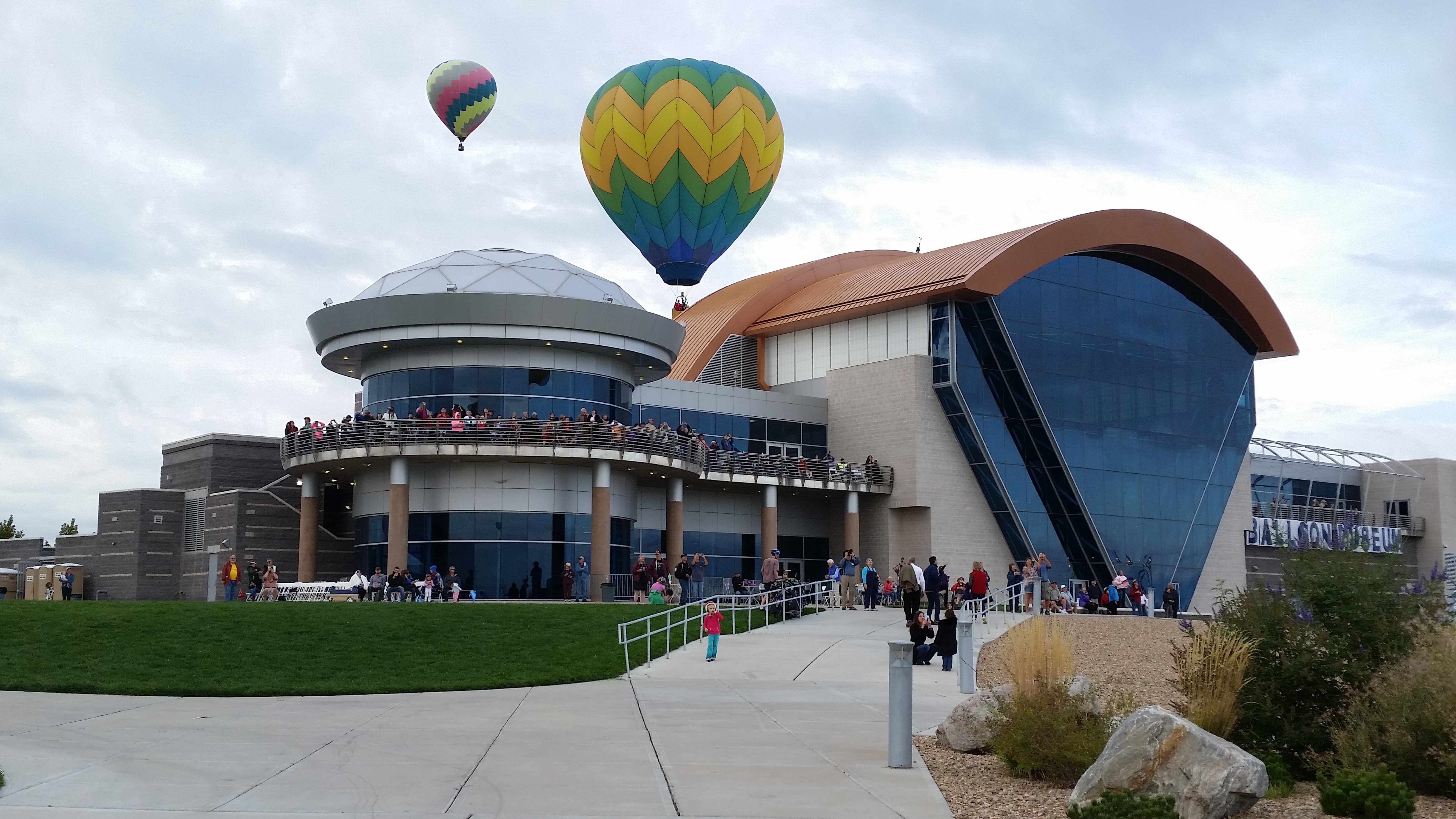 Fiesta spectators taking pictures of mass ascension