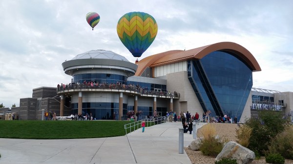 Balloons take flight above the Balloon Museum.
