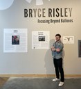Bryce Risley Poses at Exhibition