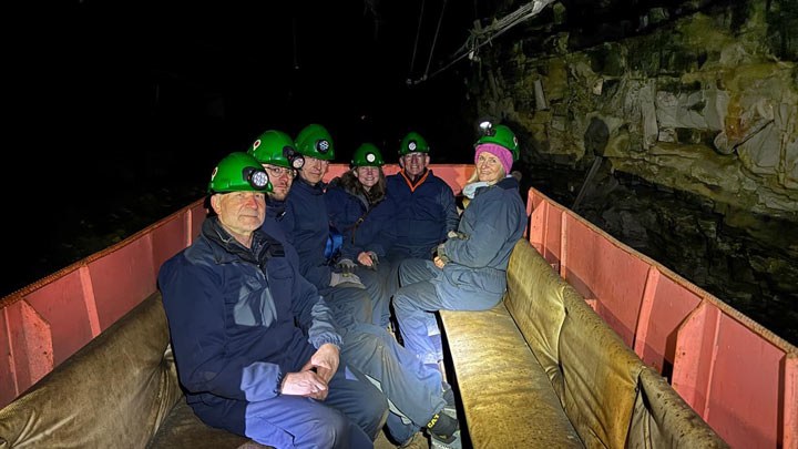 BM-Polar-Exhibition-(LOG-6-22-26)-web55a Polar Expedition team site seeing after they completed their ballooning mission. They are inside an old mine wearing hard hats.