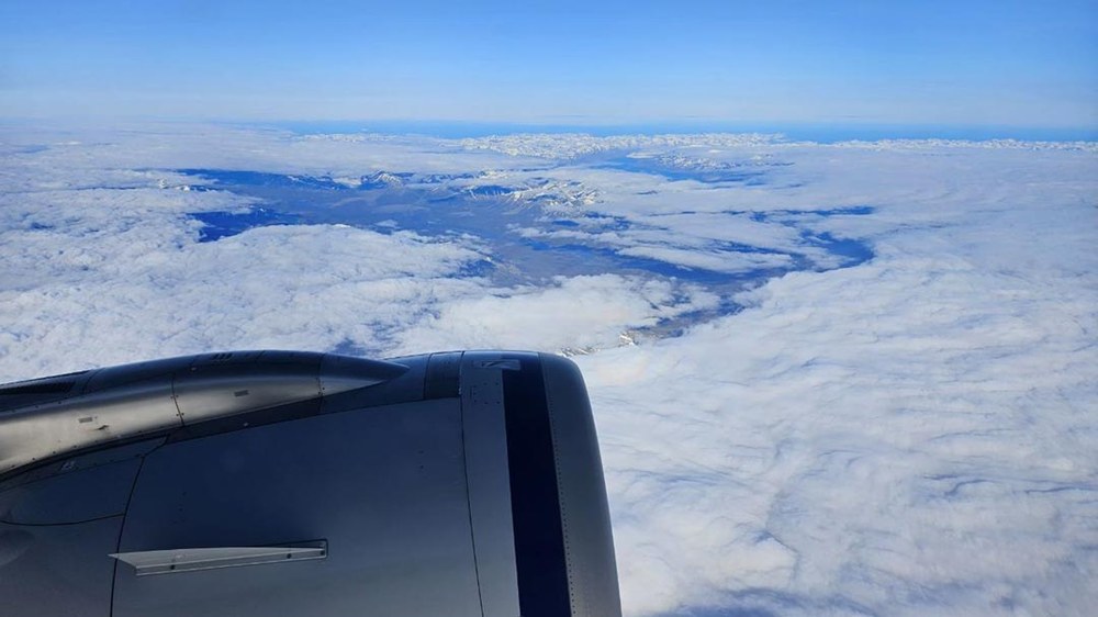 BM-Polar-Exhibition-(LOG-6-24-26)-web50 View of Svalbard from above looking out the window of an airplane.