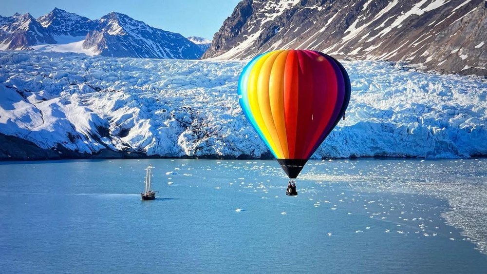 BM-Polar-Expedition(LOG-6-17-26)-web45 The Polar Expedition team taking flight in their hot air balloon with glaciers in the background.