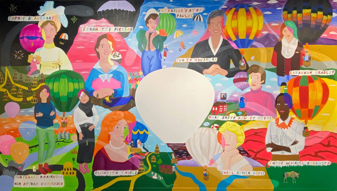 Colorful mural with portraits of women balloon pilots.
