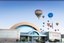 Exterior of Balloon Museum with balloons flying over