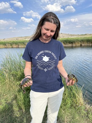 Dr. Ivana Mali, professor at North Carolina State University, holding two of the turtles at the Black River release site. Photo courtesy of Stacey Sekscienski
