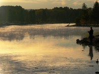 A fisherman enjoys the solitude of morning at Tingley Beach