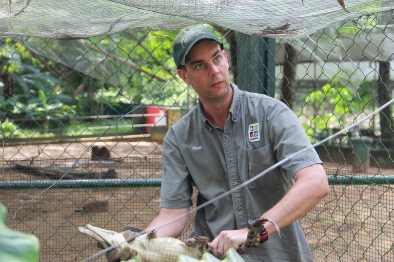 Matt Eschenbrenner with a juvenile crocodile at Zoo National d'Abidjan in 2017.