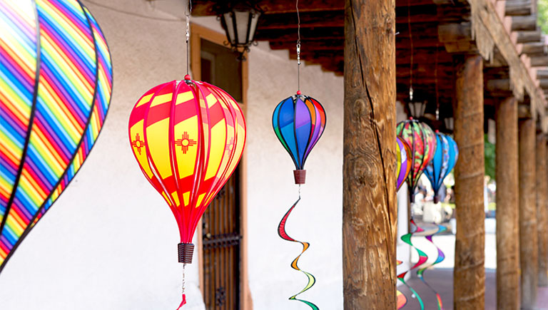 Wind sock balloons hanging from vigas in Historic Old Town.