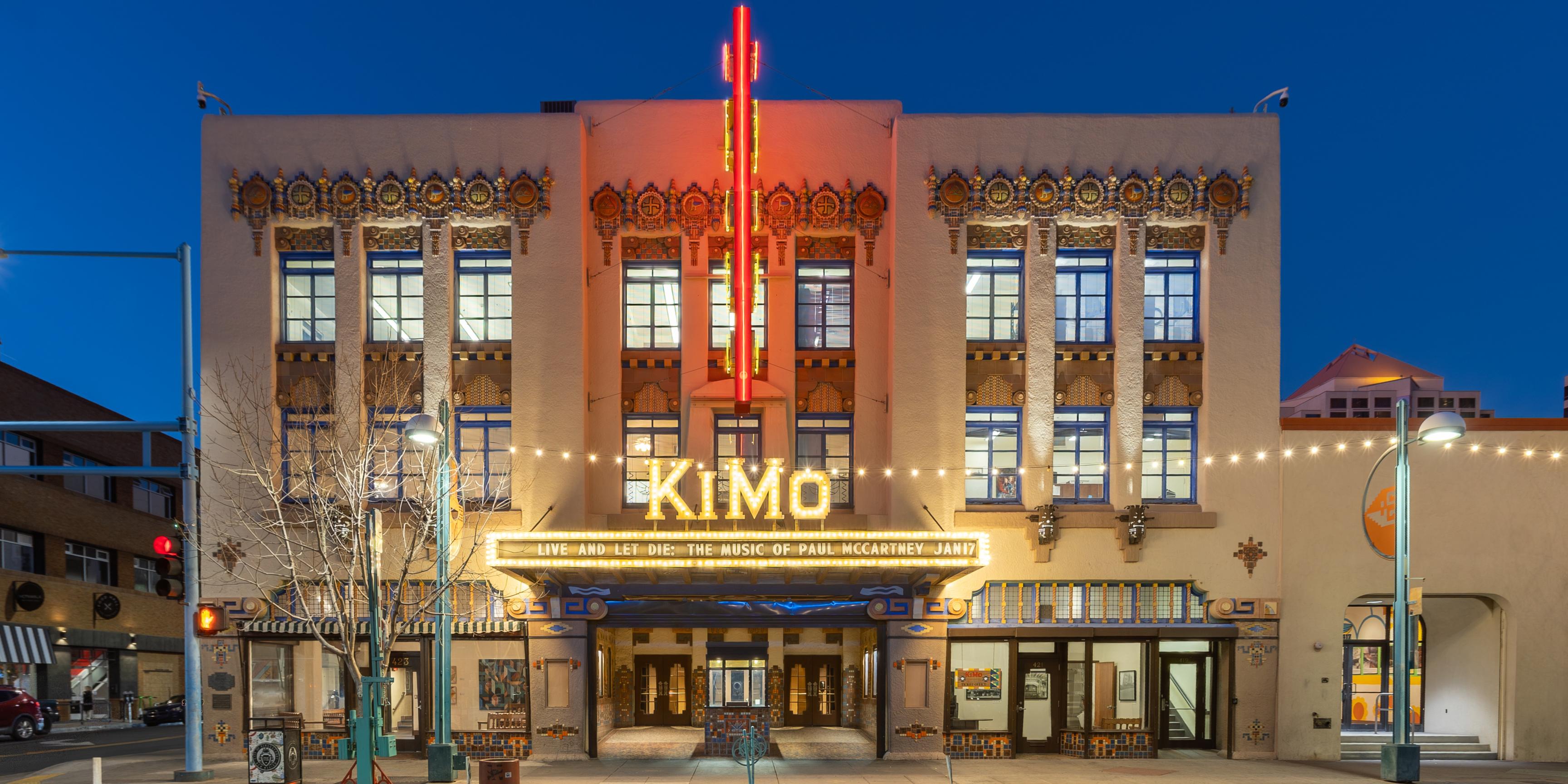 The front of the KiMo Theatre at dusk.