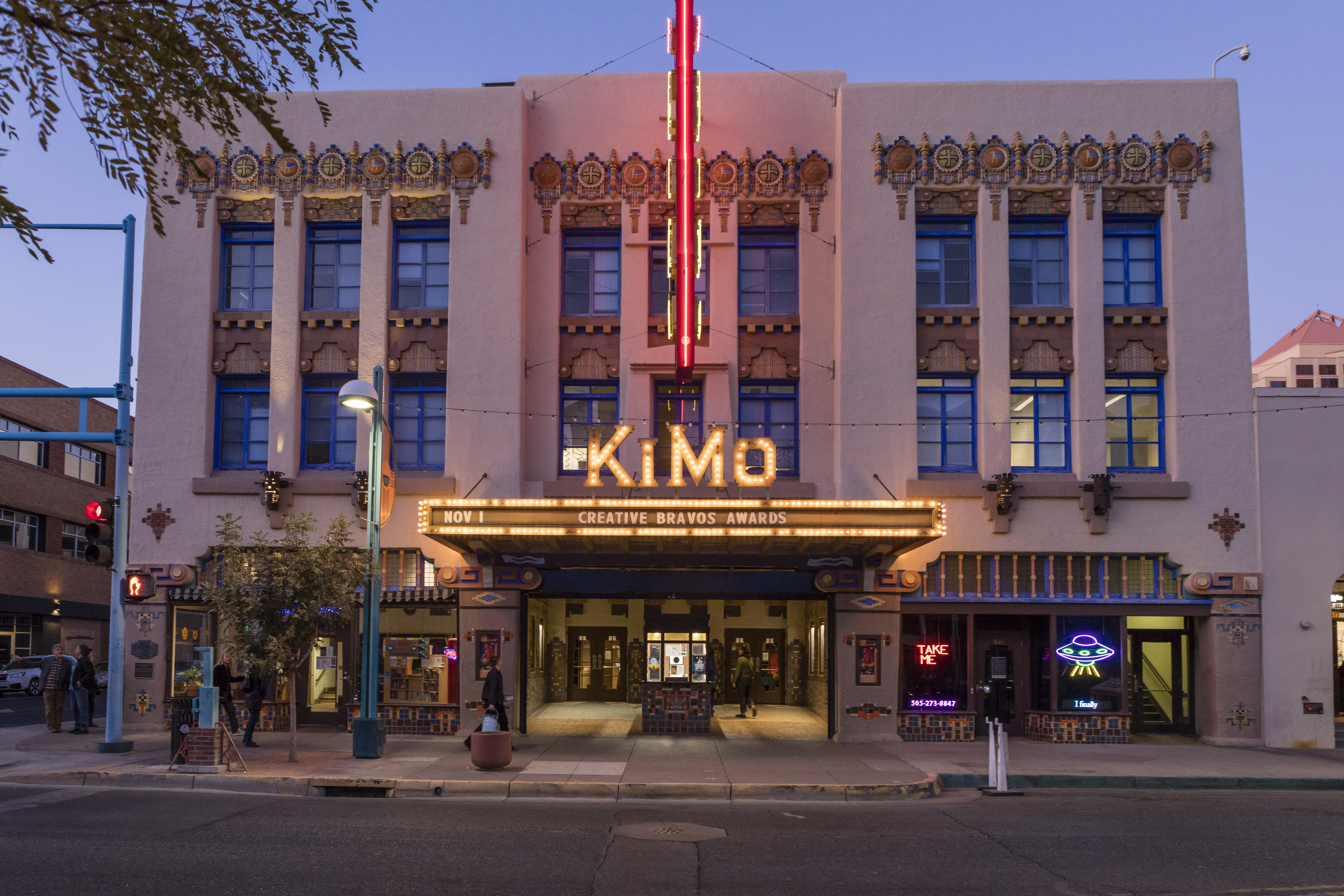 The front of the KiMo Theatre at dusk.