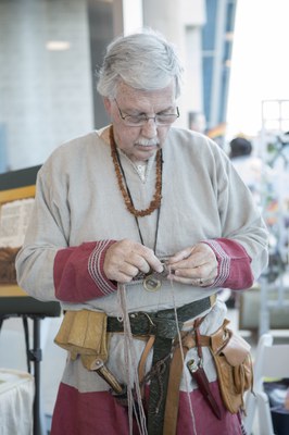 Man in the Living History area giving a live demonstration of renaissance crafts