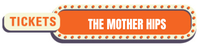 Decorative orange button with band name