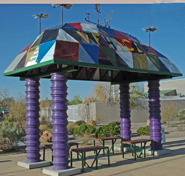 Bus stop canopy and benches made from recycled auto parts.