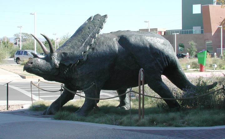 Bronze sculpture of a Pentaceratops dinosaur.