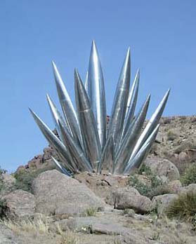 Polished aluminum sculpture of a yucca. 