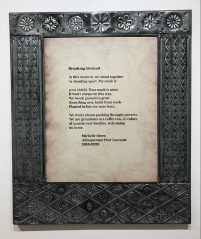 Punched tin frame by Roberto Gallegos with ornate patterns and images, for Michelle Otero's poetry excerpt "Breaking Ground."