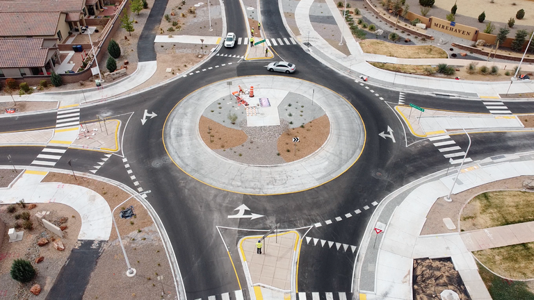 Aerial view of a roundabout in the center.