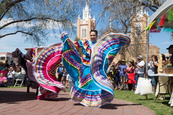 A photo of two dancers performing at historic Old Town.