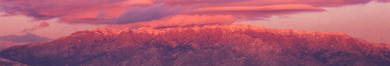 Snow-capped Sandia Mountain Sunset Banner