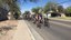Group Biking Down Street Section Highlight Block