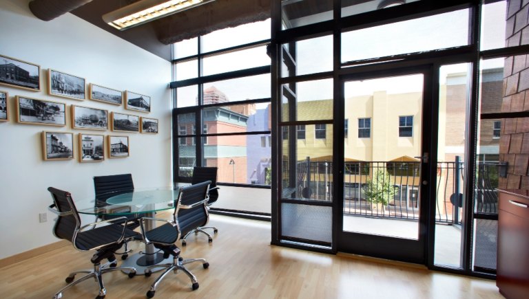 A photo of a conference room with windows.