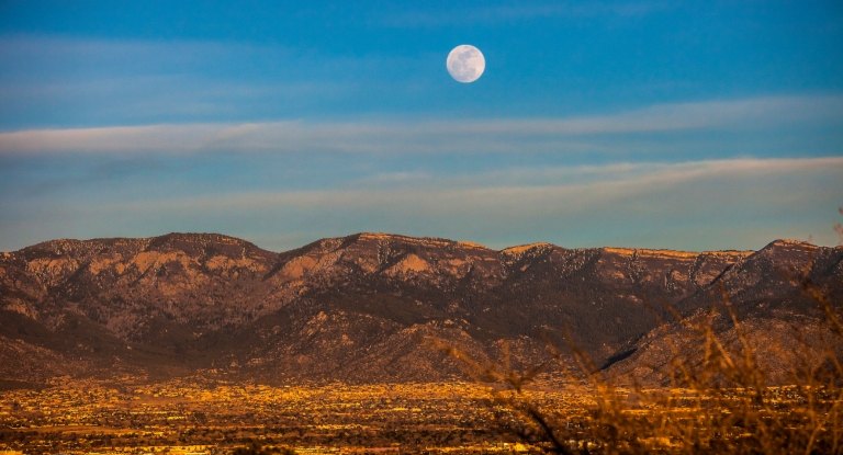 A moonrise over the Sandias.