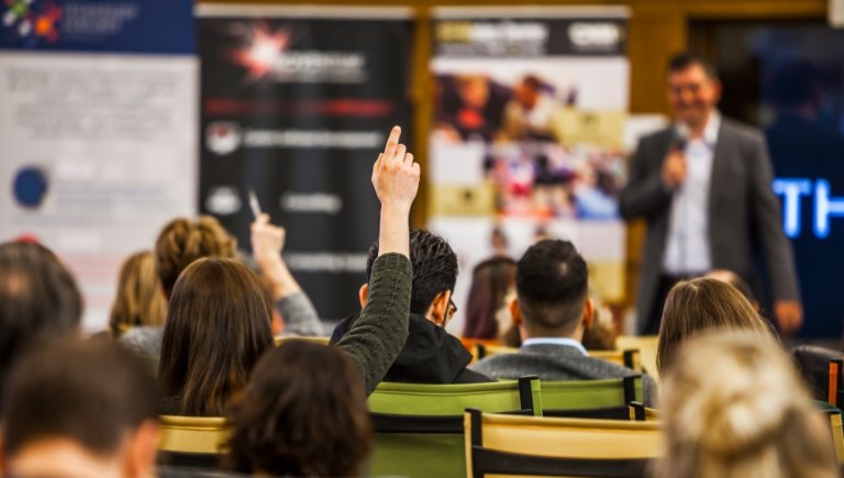 Presentation with Hand Raised