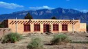 Stucco Building in Front of Sandias