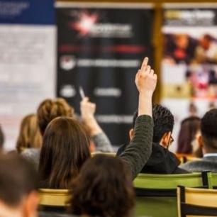 A person raising their hand.