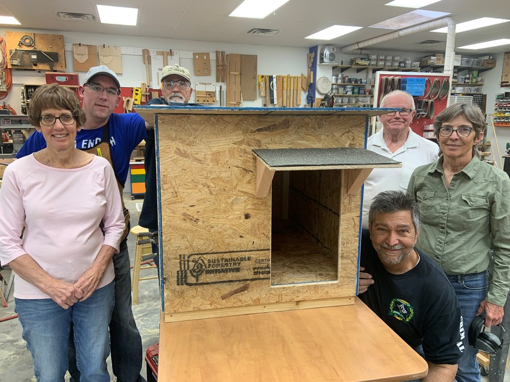 Albuquerque Woodworkers Association VP John M. Henderson III with volunteers