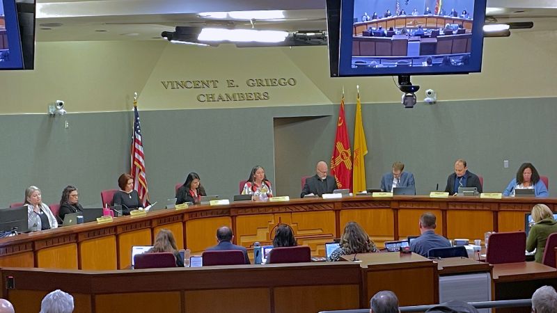 The full city council having a meeting in the Vincent E. Griego Chambers.