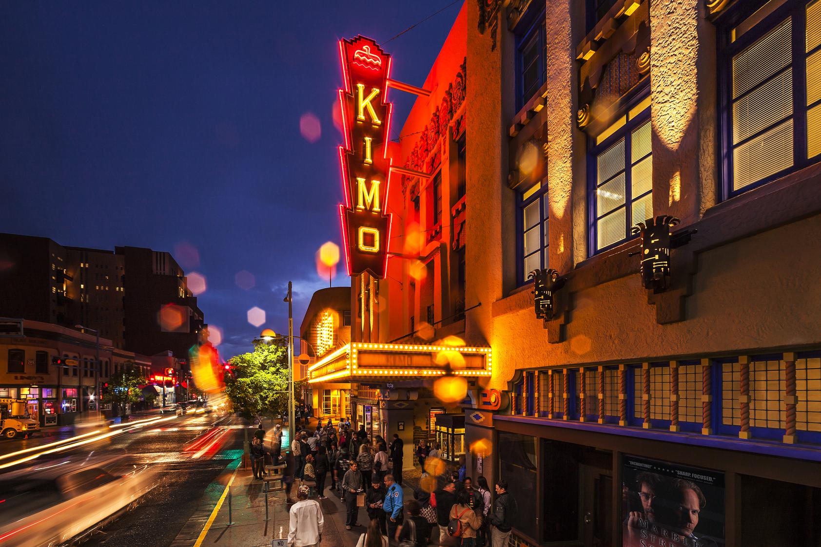 Crowds waiting to enter the Kimo Theater at night.