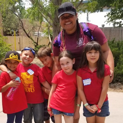 Inclusion Rec 01 Staff with several children smiling for an outdoor activity