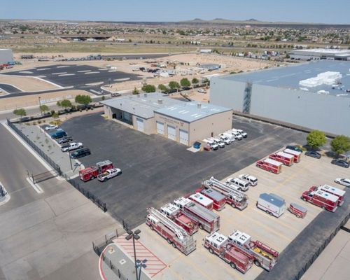An aerial photo of a fire-station with AFR emergency vehicles parked outside.