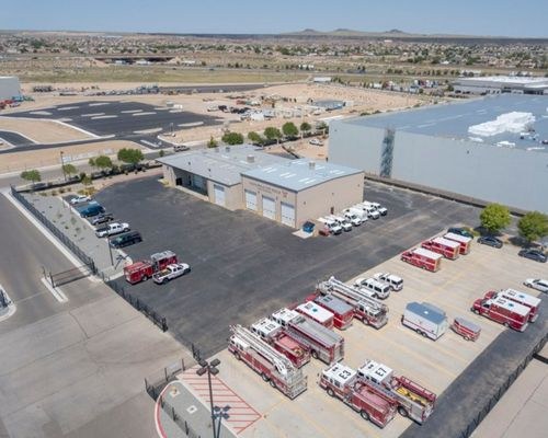 An aerial photo of a fire-station with AFR emergency vehicles parked outside.