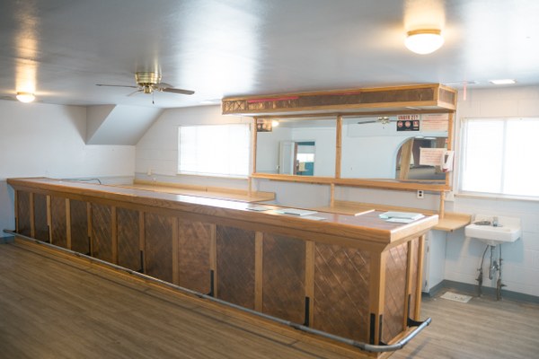 International District Opportunity Center Bar Interior of International District Opportunity Center with a bar and service area.