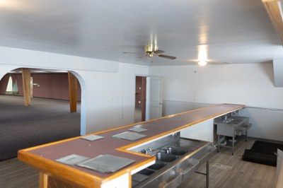 A long counter with a glass desk under it.